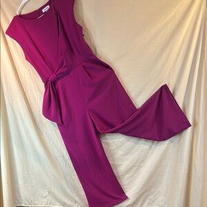 Elegant Calvin Klein Plum Jumpsuit. Peekaboo slit on left shoulder.
